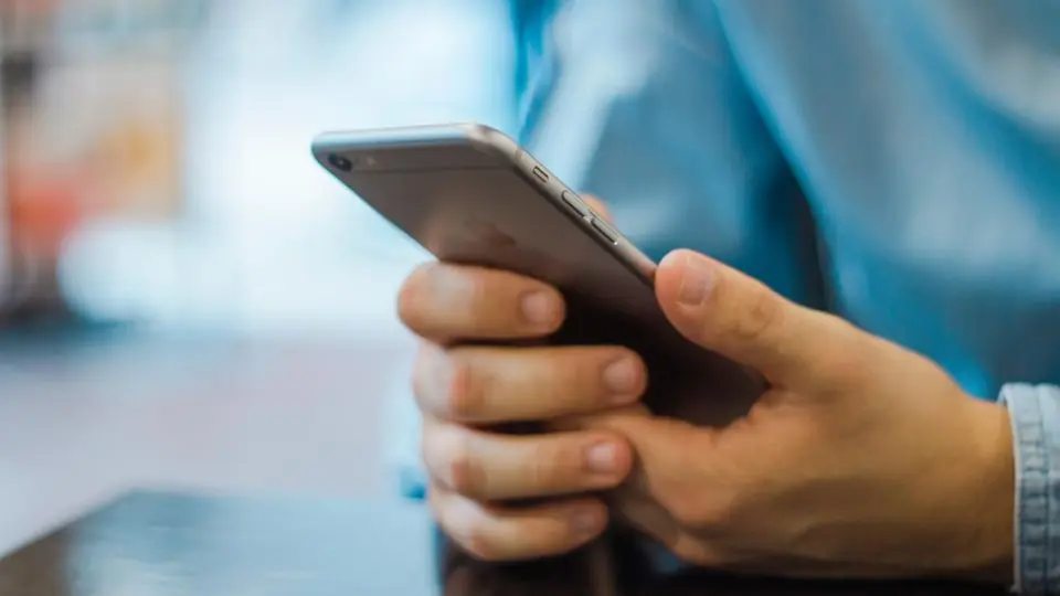 Hand holding a smartphone