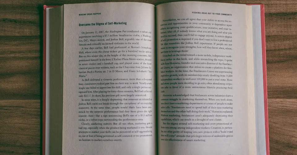 Open book with pages of text on a table